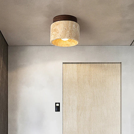 Plafonnier LED en travertin éclairant une chambre