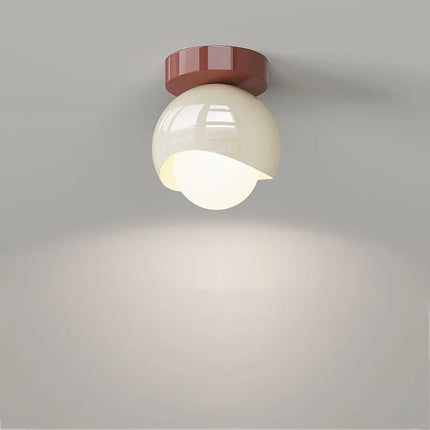 Nordic ceiling light in glass diffusing a soft light in a bedroom