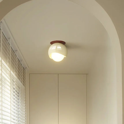 LED ceiling light in Nordic glass mounted on the ceiling of a Scandinavian living room