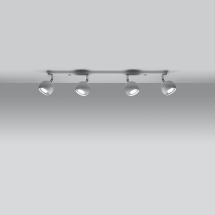 Plafonnier oculaire 4 spots orientables barre blanc installé dans une pièce lumineuse