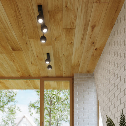 Plafonnier oculaire 4 spots orientables barre noir dans une ambiance déco épurée