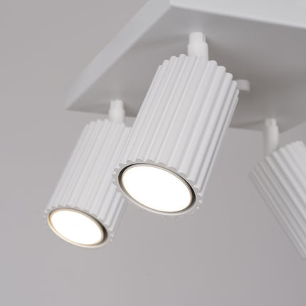 Plafonnier Oslo 4 blanc vu de dessous, douilles GU10 visibles au centre de chaque spot