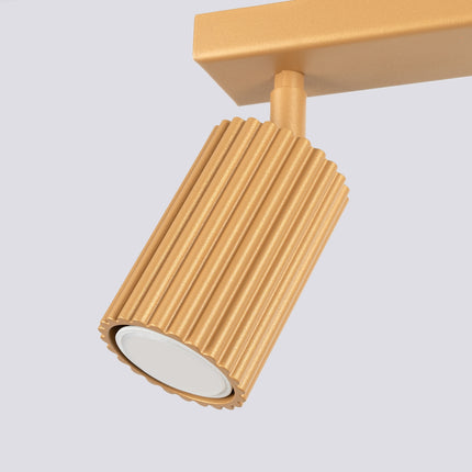 Plafonnier Oslo barre 2 spots orientables 30 cm or, vue sur fond coloré