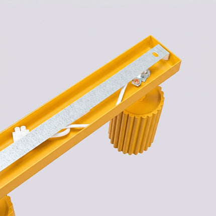 Plafonnier Oslo barre 3 spots orientables 45 cm jaune ambré, détail de la fixation