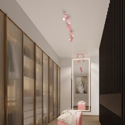 Plafonnier Oslo barre 3 spots orientables 45 cm rose poudré au-dessus d'un plan de travail