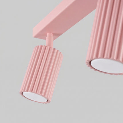 Plafonnier Oslo Barre 4 Spots Orientables 81 cm en Aluminium Rose Poudré, vue sur fond coloré