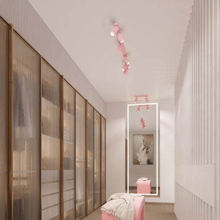 Plafonnier Oslo barre 6 spots orientables 117 cm rose poudré au-dessus d'un plan de travail