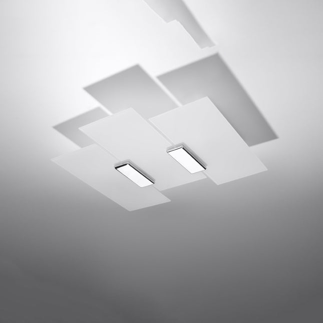 Plafonnier Panneaux Géométriques Blanc dans un salon