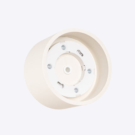 Plafonnier Pastille beige, vue sur fond coloré