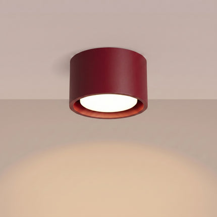Plafonnier Pastille bordeaux, lumière allumée