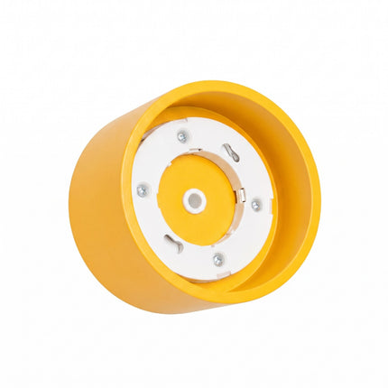 Plafonnier Pastille jaune ambré, vue sur fond coloré