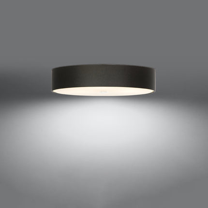 Plafonnier rond en tissu noir de 70 cm, abat-jour tambour et diffuseur en verre, allumé sur fond gris