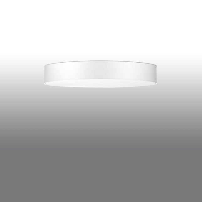 Plafonnier rond tissu blanc allumé diffusant une lumière chaude et homogène