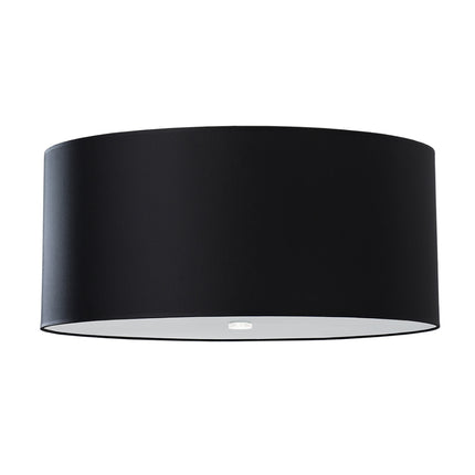 Plafonnier tissu noir allumé, détail du diffuseur en verre diffusant une lumière chaude