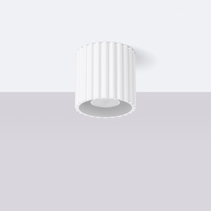 White fluted Aura ceiling spotlight fixed to the ceiling in a bright room