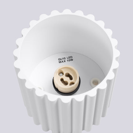 Detail of the grooved aluminium relief of the matte white Aura spot ceiling light