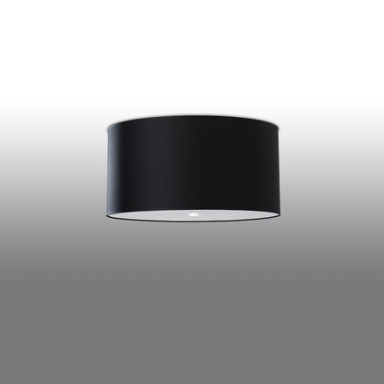 Plafonnier tambour en tissu noir, large abat-jour rond avec diffuseur clair sur fond gris dégradé