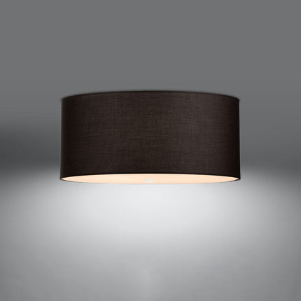 Plafonnier rond en tissu noir 70 cm allumé, lumière chaude adoucie par le diffuseur en verre.