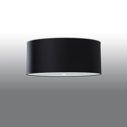 Plafonnier rond en tissu noir de 70 cm monté au ras du plafond, abat-jour cylindrique et diffuseur en verre.