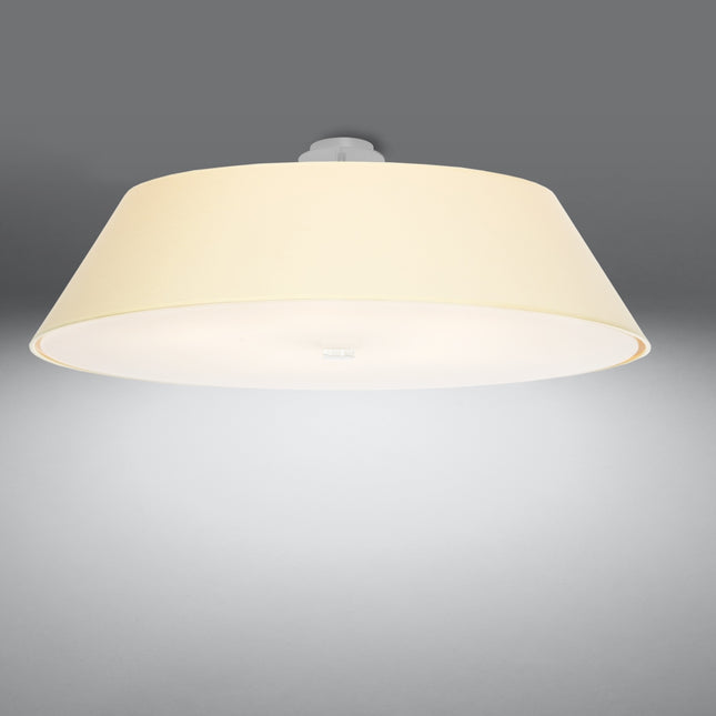 Plafonnier Trapèze en tissu blanc allumé, lumière chaude diffusée à travers le verre