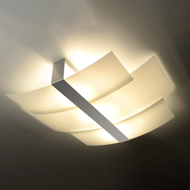 Plafonnier Triple Courbe en verre chromé en situation dans un intérieur moderne