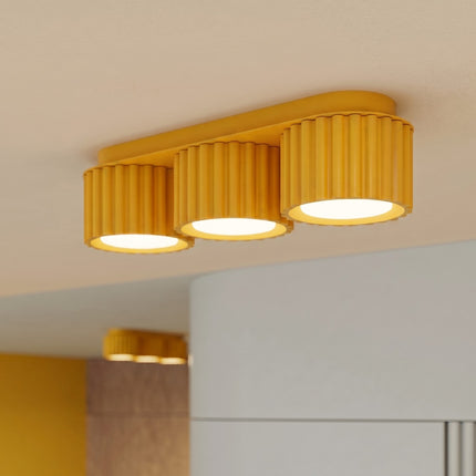 Plafonnier triple spot Aura jaune ambré, intérieur contemporain