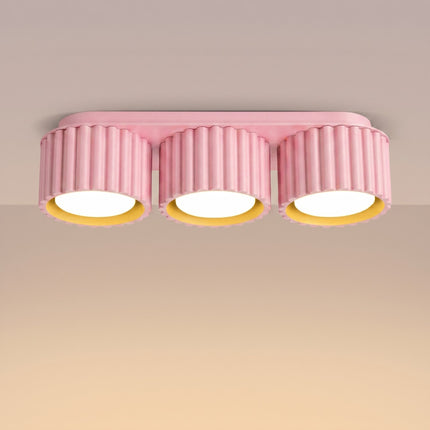 Plafonnier triple spot Aura rose poudré, lumière allumée