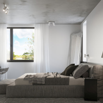 Chambre scandinave avec plafonniers tube orientables et applique assortie