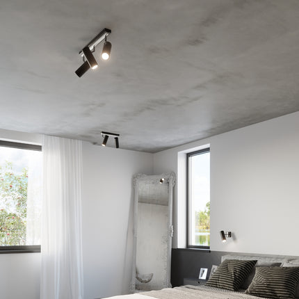 Vue d'ensemble d'une chambre avec plafonnier tube ajustable noir au plafond