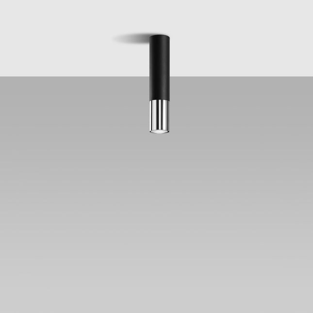Plafonnier cylindrique noir et chrome fixé au plafond, faisceau dirigé vers le bas