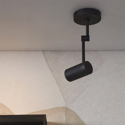 Spot de plafond Montreux noir, silhouette minimaliste sur fond de mur texture
