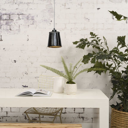 Pendant light Amazon black lighting a white console table with green plants