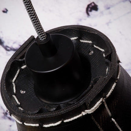 Detail of the black socket and the golden interior of the Amazon pendant light