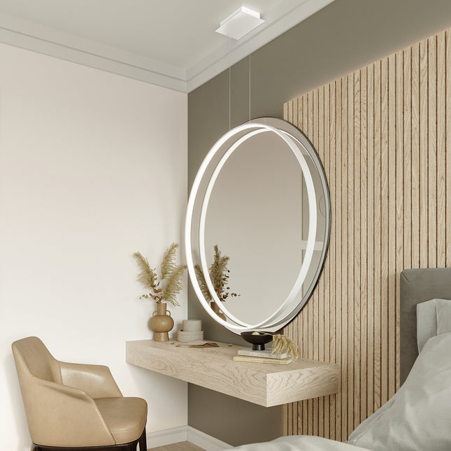 Suspension Anneau Solis 110 cm blanche allumée au-dessus d'une coiffeuse avec miroir rond