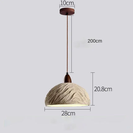 Suspension en ciment effet pierre à la lumière chaleureuse
