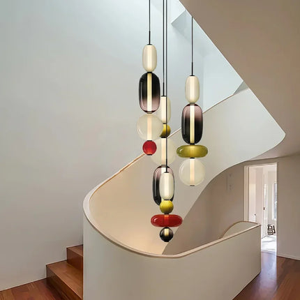 Suspension créative verre coloré empilé allumée diffusant une lumière chaude