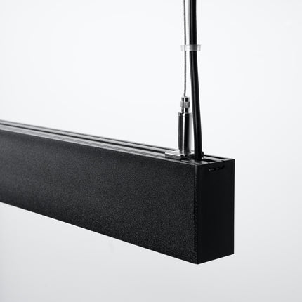 Détail des lentilles anti-éblouissement de la Suspension Design Poutre allumée