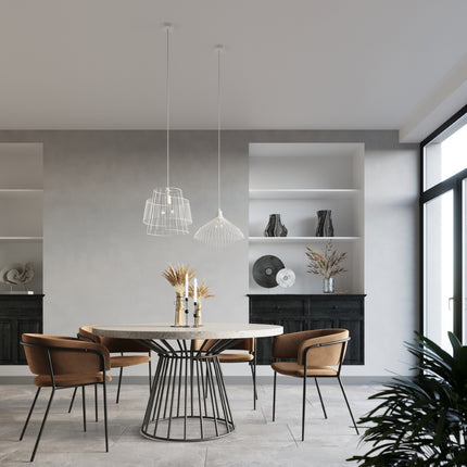 Suspension Fleur blanche a cage filaire au-dessus d'une table ronde en travertin dans une salle a manger