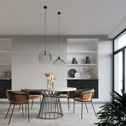 Suspension Fleur noire a cage filaire au-dessus d'une table ronde en travertin dans une salle a manger