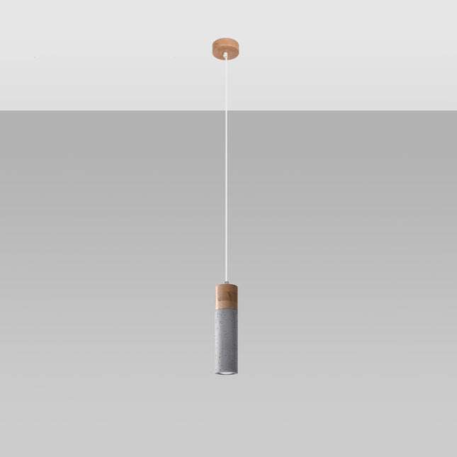 Suspension Fusion Minimaliste 1 spot suspendue à un câble fin, tube cylindrique en béton gris et bois clair, style japandi.