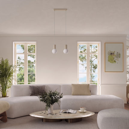 Suspension Halo 2 globes sur barre beige au-dessus d'une table à manger