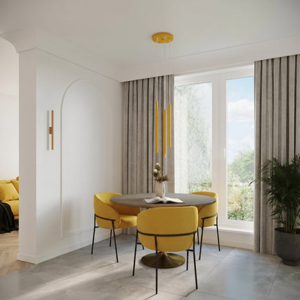 suspension halo 3 tubes étagés jaune ambré en acier, au-dessus d'une table