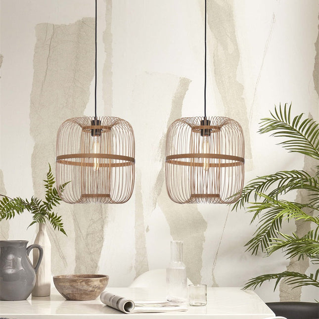 Two natural bamboo Hokkaido pendant lights hanging above a white dining table
