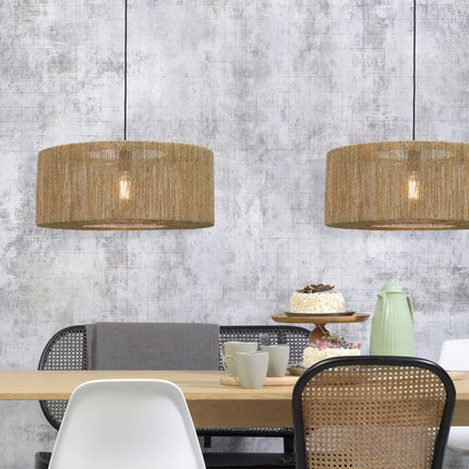 Two natural woven jute Iguazu pendant lights installed side by side above a dining table