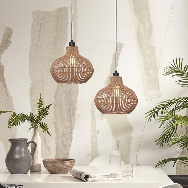 Two natural woven rattan Kalahari pendant lights hanging above a dining table