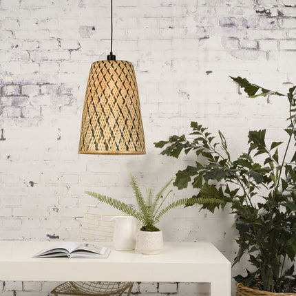 Pendant light Kalimantan in natural conical braided bamboo and black hanging above a console table in a bohemian interior