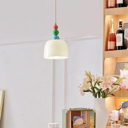 Suspension design français coloris beige en verre et métal