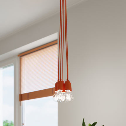Suspension Ligne Pure orange dans un salon contemporain