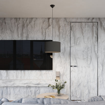 Suspension Loft Cylindrique Noire 40 cm, allumée, gros plan sur la lumière diffusée