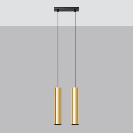 Suspension Long Cylindre 2 Or Poli, deux abat-jour cylindriques en acier doré au-dessus d'une table à manger